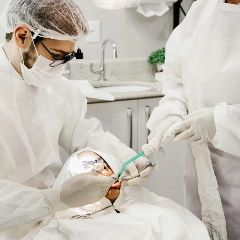 Dentist preparing for an emergency tooth extraction.