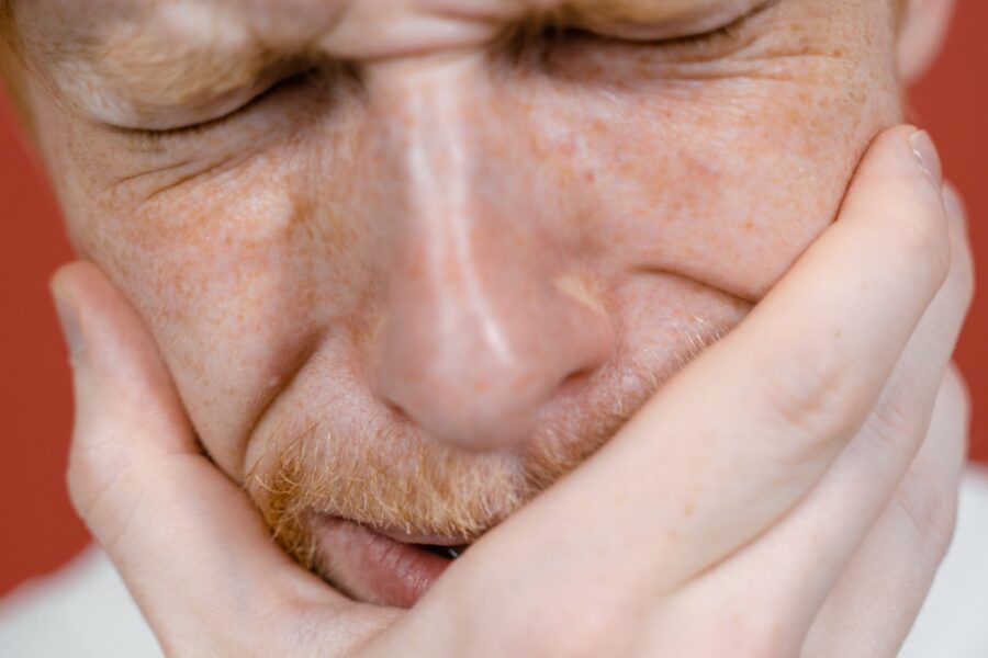 Man trying ti find home remedies for his tootache