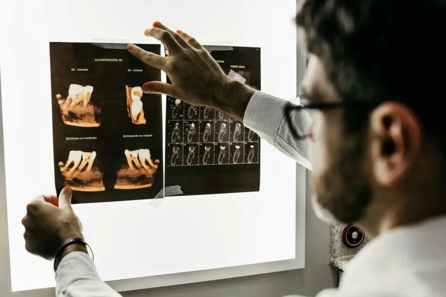 Dentist explaining how much a wisdom teeth removal costs to a patient from Bellevue